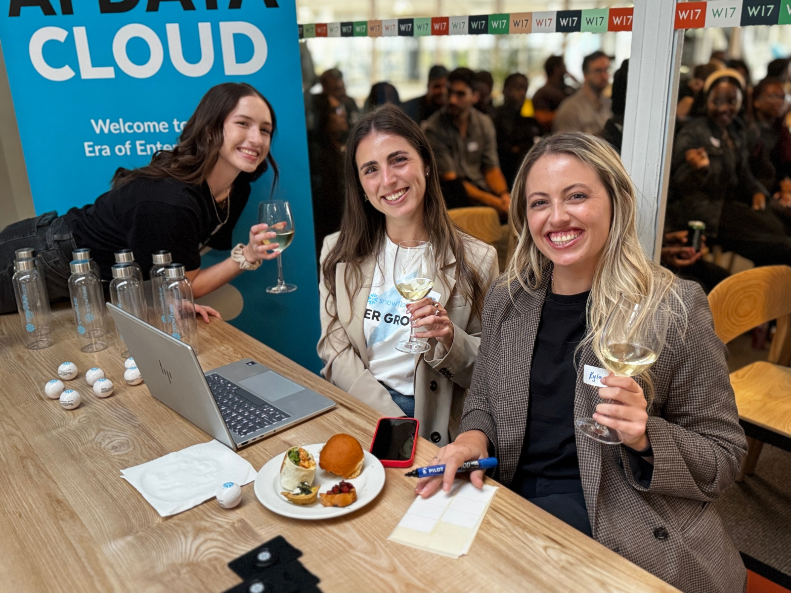 Datalab team at a Snowflake AI Data Cloud event wearing From RAGs to Rich Apps branded tees